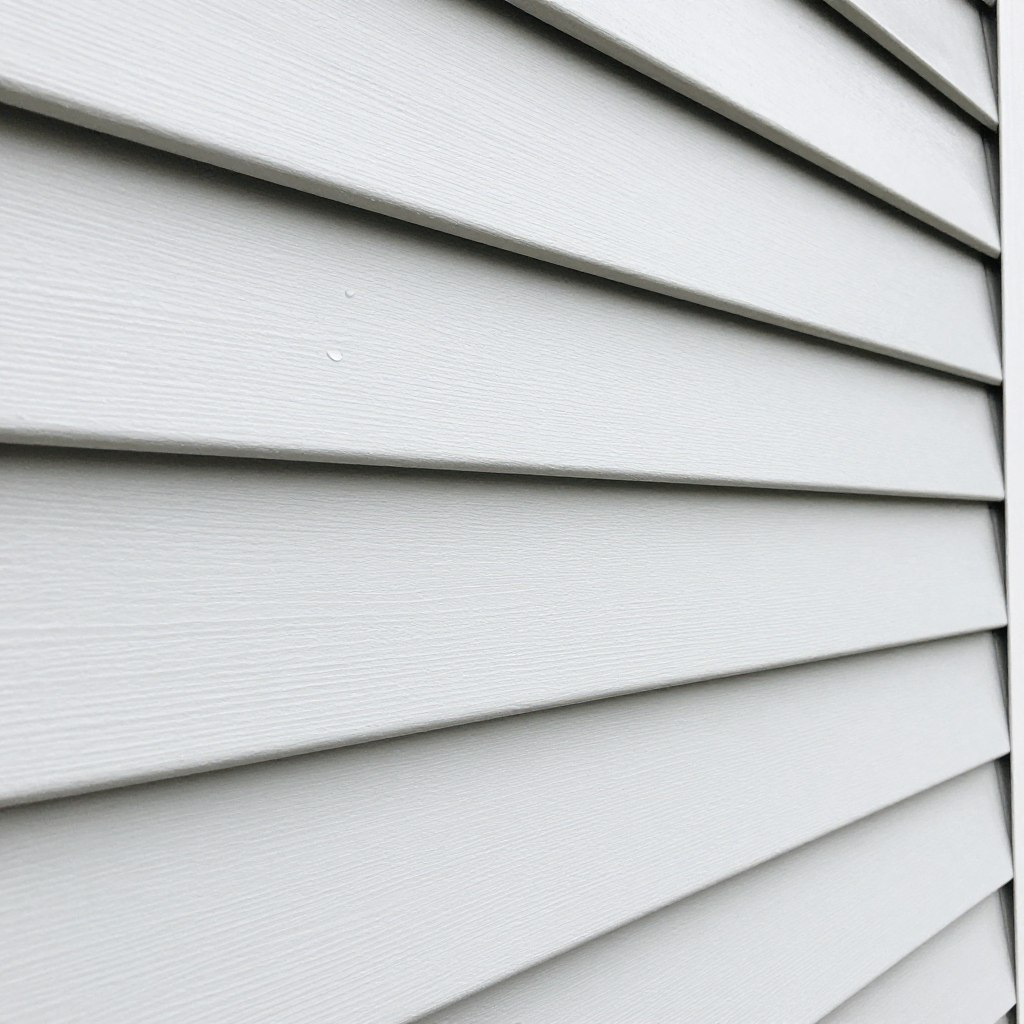 Clean vinyl siding on Ludlow home after professional pressure washing treatment Clean vinyl siding on Ludlow home after professional pressure washing treatment