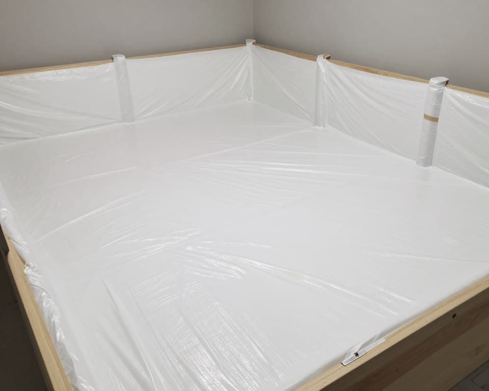 Crawl space encapsulation project in Ludlow showing vapor barrier installation